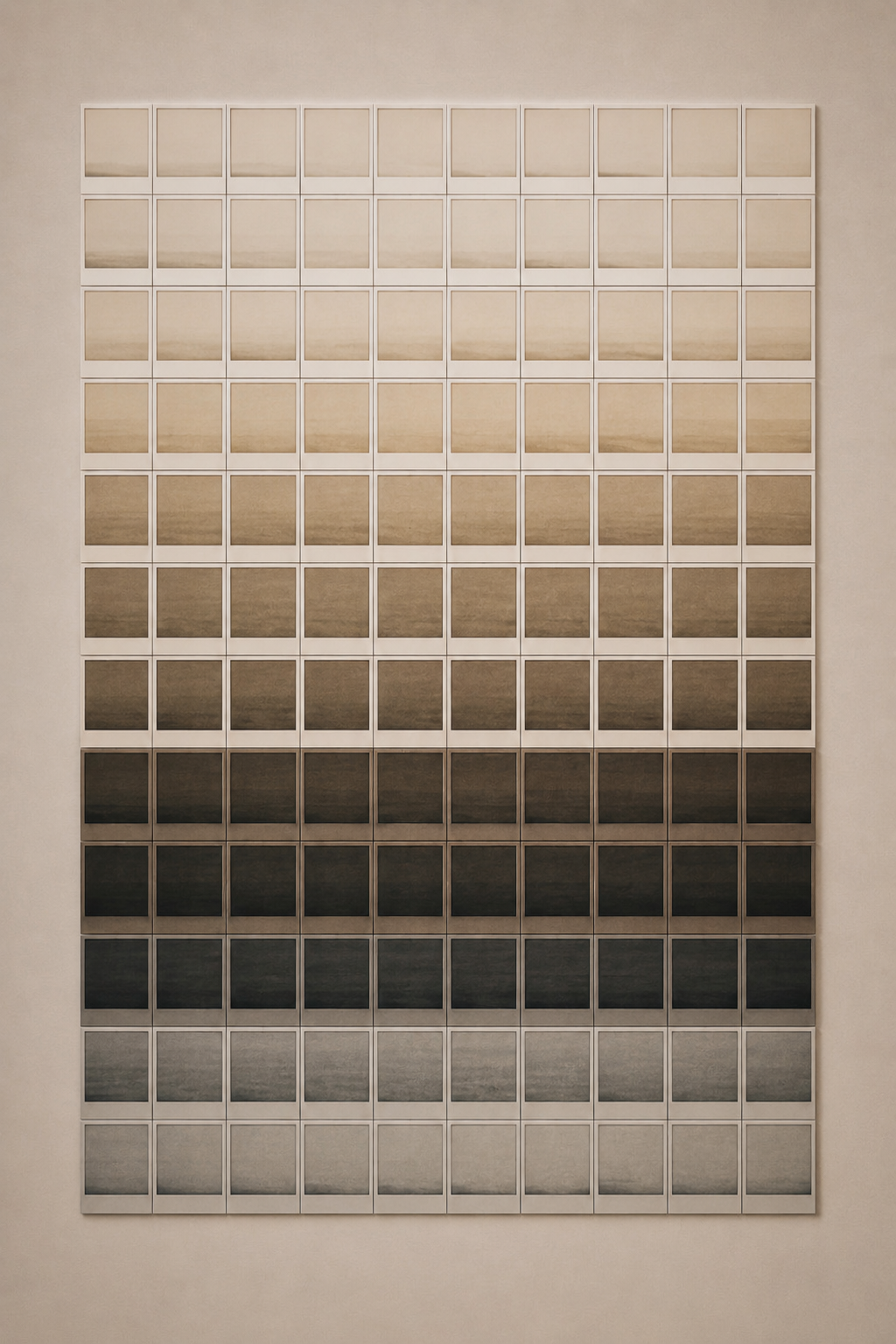 A wall grid of small instant photographs fading row by row from pale sepia through brown to black and back to grey